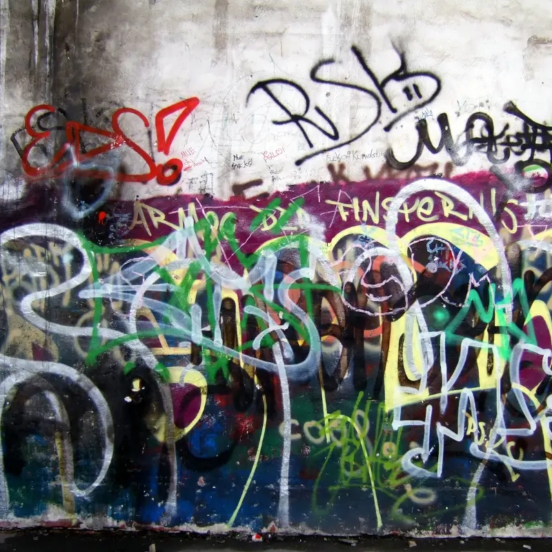 Vandalism in a subway with graffiti